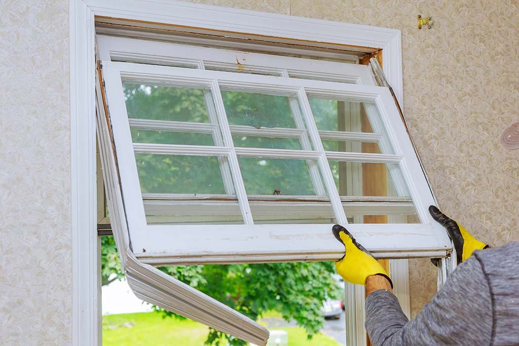 Man installing a window